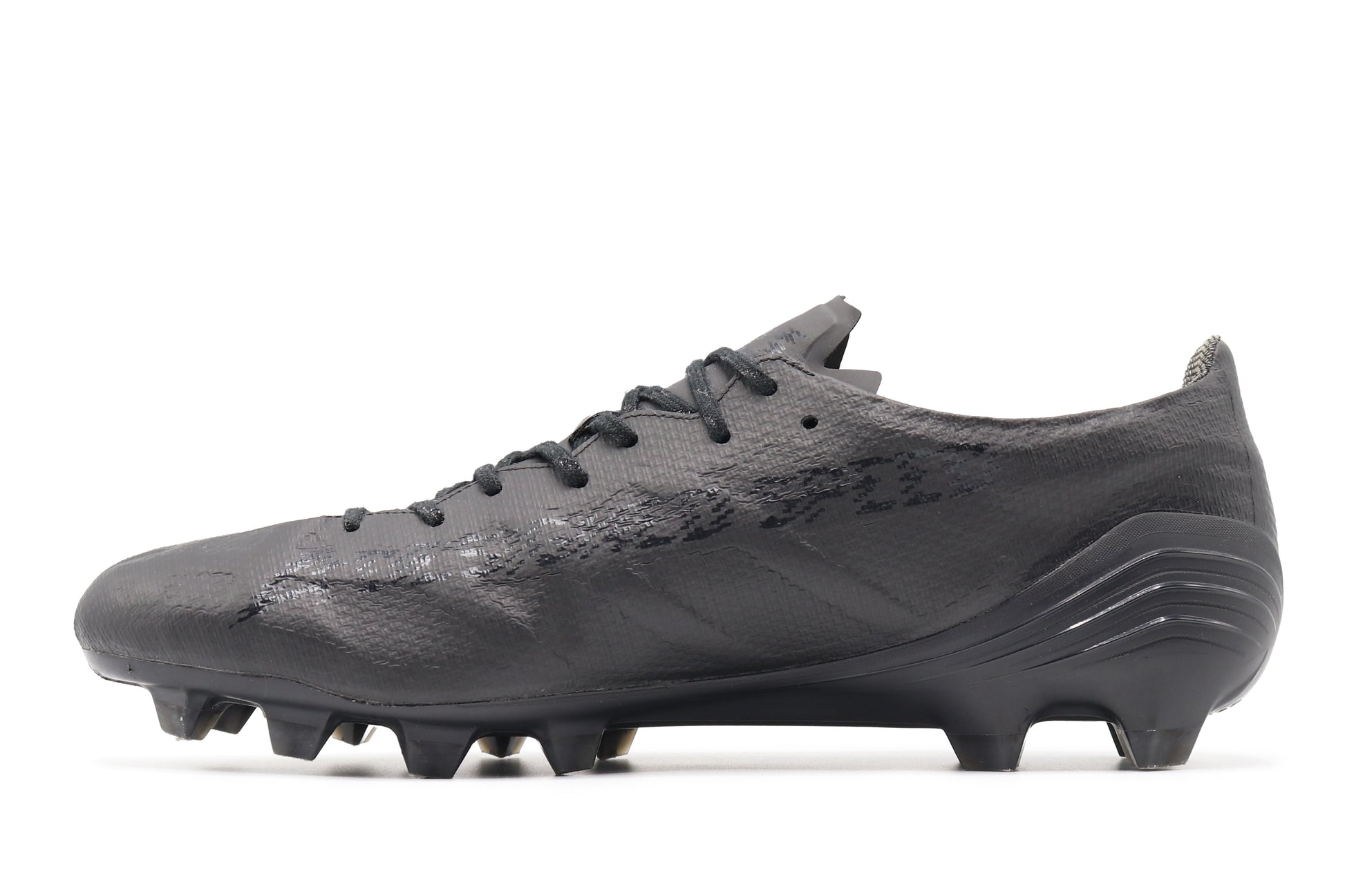 Mizuno Alpha Elite Made In Japan FG 'Sample', in a fully black colorway, photographed from the left side of the football boot