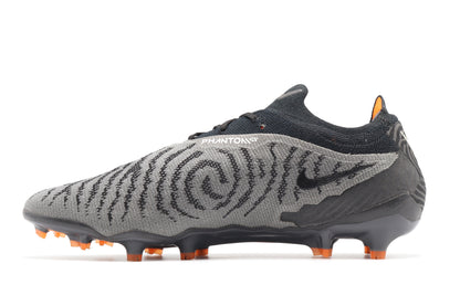 Nike Phantom GX Elite FG, in the Black/Summit White/Dark Smoke Grey colorway, photographed from the left side of the football boot