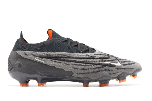 Nike Phantom GX Elite FG, in the Black/Summit White/Dark Smoke Grey colorway, photographed from the right side of the football boot